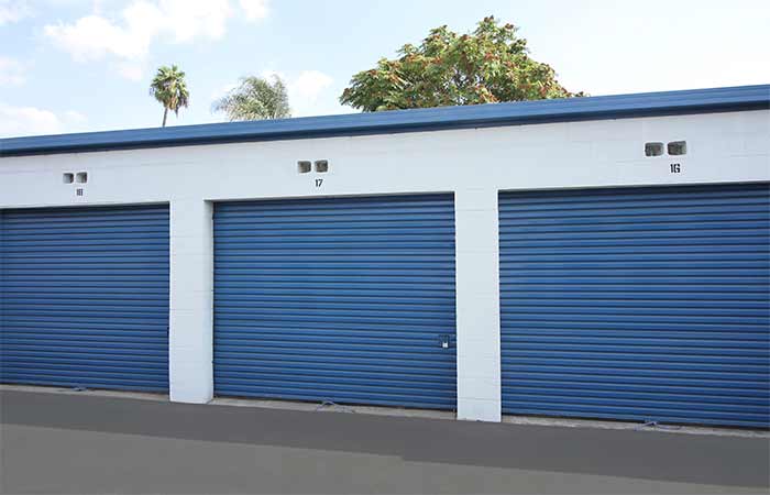 Large drive-up storage units with easy access and roll-up doors.