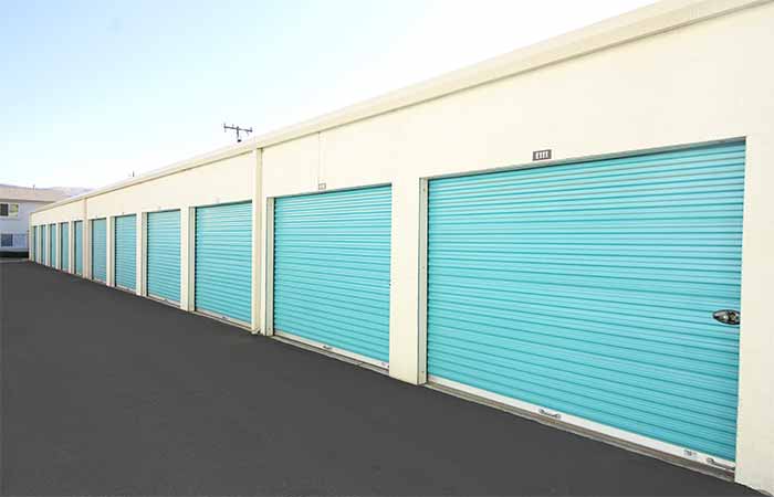 Drive-up storage units with roll-up doors.